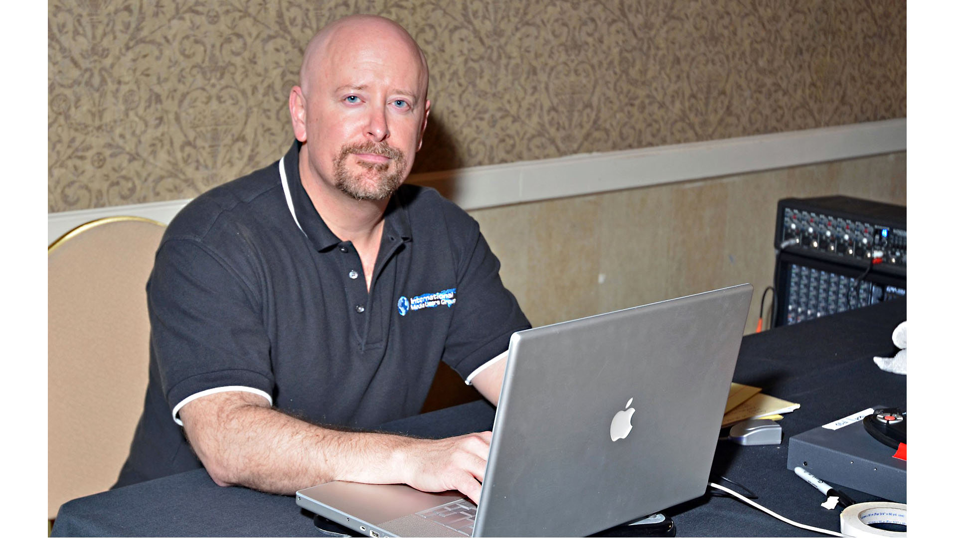 Chris Rogers (Owner/Operator of CHRMEDIA) working on laptop