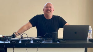 Big Brothers Big Sisters of America Conference 2022 Chris Rogers smiling at desk