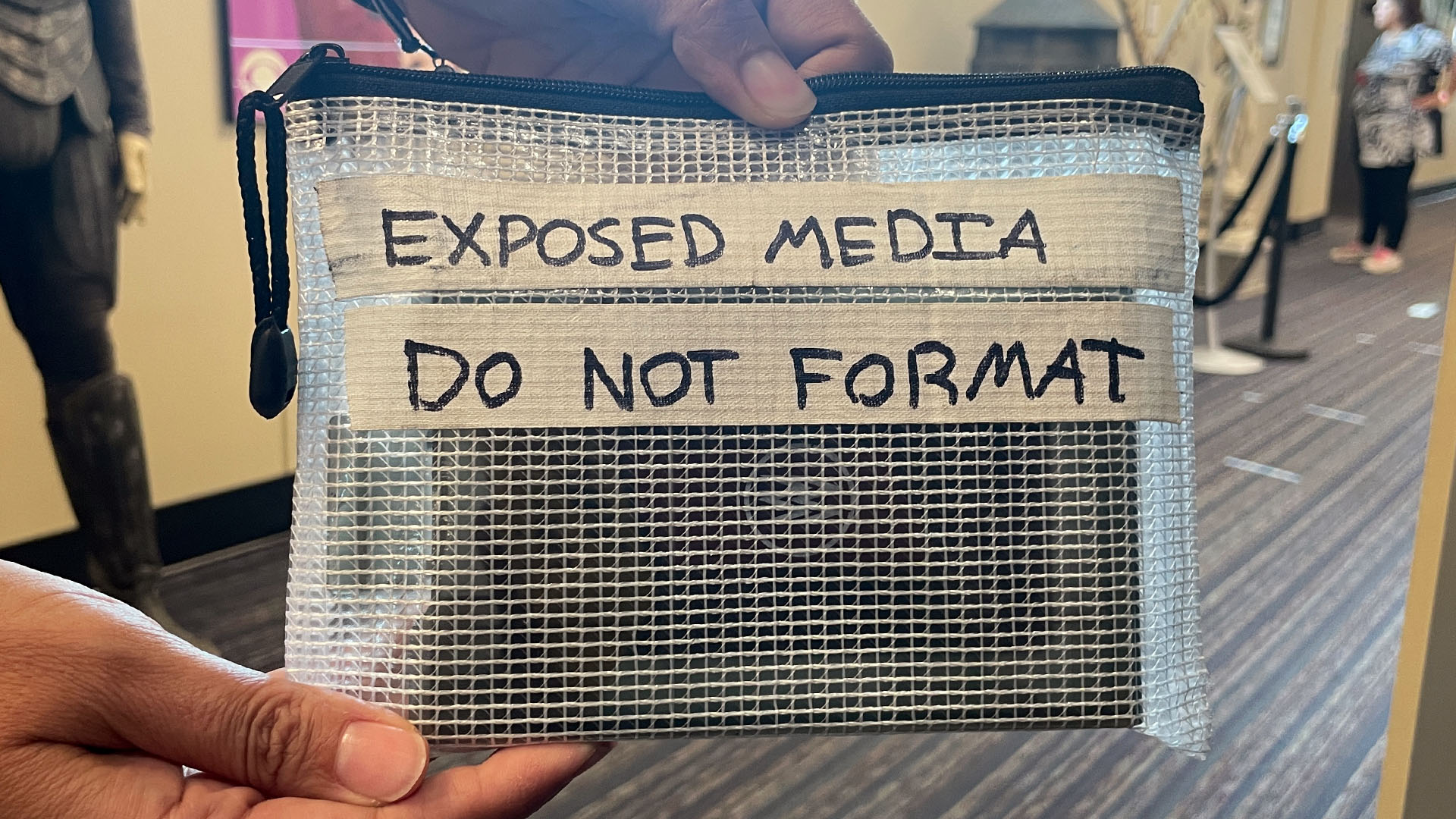 card transport pouch with exposed media inside