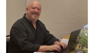 Chris at desk smiling